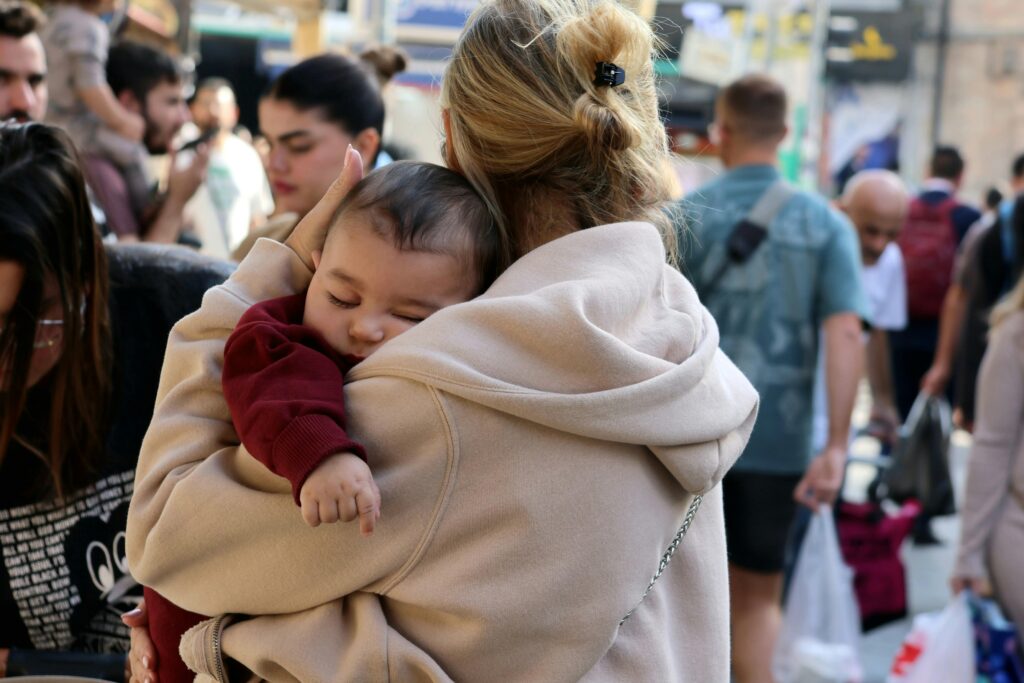 a woman holding a baby